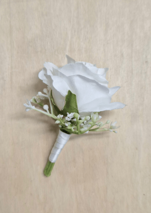 Artificial wedding boutonniere with a white faux rose, pale berry sprigs and fern-like foliage, finished with ivory-wrapped stems. For formals, proms and ball occasions. Made in Melbourne by Flowers For Ever After, shipping Australia and Worldwide.