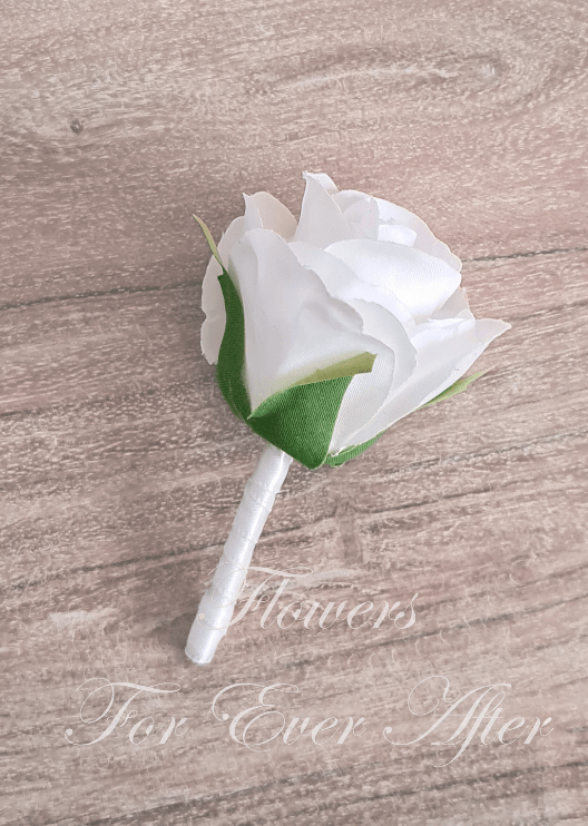 Artificial wedding boutonniere with a white faux rose, a small dusty pink rose, pale berry sprigs, fern-like foliage and wrapped stems. For formals, proms and ball occasions. Made in Melbourne by Flowers For Ever After, shipping Australia and Worldwide.