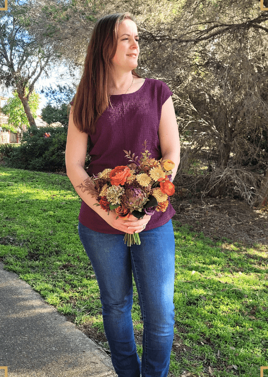 Artificial wedding bridal bouquet, handheld front view of orange, yellow and burgundy faux blooms and trailing ribbon. Made in Melbourne by Flowers For Ever After, shipping Australia and Worldwide.