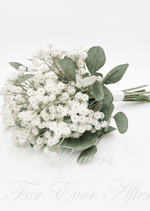 Artificial wedding bridesmaid posy, angled view of white faux baby's breath, grey-green leaves and ribbon-wrapped stems. Made in Melbourne by Flowers For Ever After, shipping Australia and Worldwide.