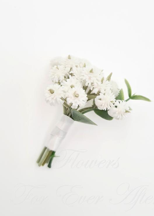 Artificial wedding boutonniere with clustered white faux baby's breath, grey-green leaves and ivory-wrapped stems. For formals, proms and ball occasions. Made in Melbourne by Flowers For Ever After, shipping Australia and Worldwide.