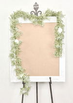 Artificial wedding sign garland with white faux baby's breath and white roses trailing down both frame sides. Made in Melbourne by Flowers For Ever After, shipping Australia and Worldwide.