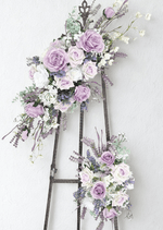 Artificial wedding angled arbor floral set with lilac and white faux roses, white orchids, purple flower spikes and eucalyptus. Made in Melbourne by Flowers For Ever After, shipping Australia and Worldwide.