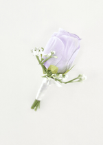 Artificial wedding boutonniere with a lilac faux rosebud, tiny white flowers and white-wrapped stems. For formals, proms and ball occasions. Made in Melbourne by Flowers For Ever After, shipping Australia and Worldwide.