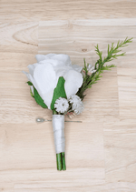 Artificial wedding boutonniere with a white faux rose, tiny white flowers, a slender green sprig and ivory-wrapped stems. For formals, proms and ball occasions. Made in Melbourne by Flowers For Ever After, shipping Australia and Worldwide.