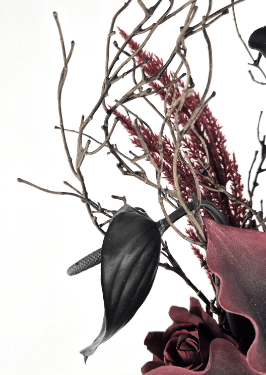 Artificial wedding bouquet detail showing a black faux anthurium, burgundy plume-like sprigs, dark branches and burgundy calla lily petals. Made in Melbourne by Flowers For Ever After, shipping Australia and Worldwide.
