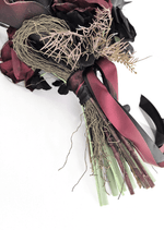 Artificial wedding bouquet handle detail with gathered faux flower stems, black and burgundy ribbons, fine bronze sprigs and dark blooms. Made in Melbourne by Flowers For Ever After, shipping Australia and Worldwide.