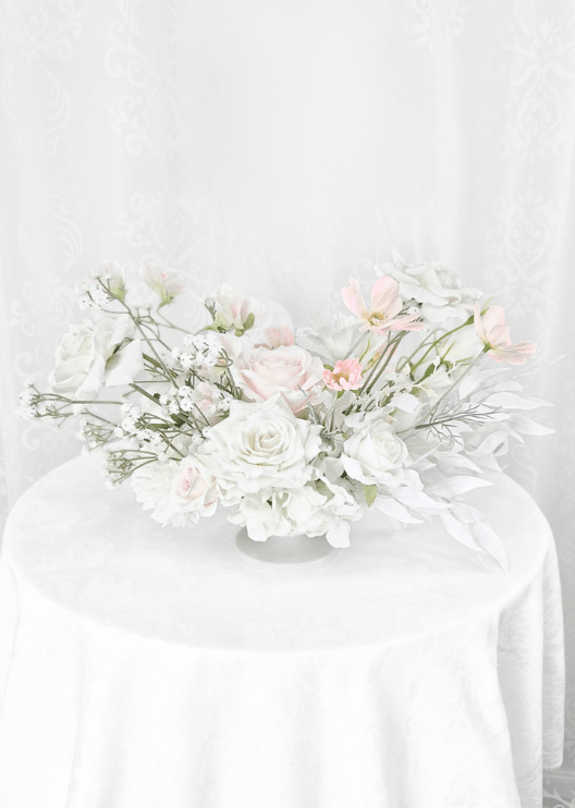 Artificial wedding table arrangement, reverse view of blush and white faux roses, white dahlias, pale pink blooms and fine branches. Made in Melbourne by Flowers For Ever After, shipping Australia and Worldwide.