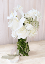 Artificial wedding bridal bouquet with white faux anthuriums, dahlias, roses and ranunculus, cream flower clusters and trailing green berries. Made in Melbourne by Flowers For Ever After, shipping Australia and Worldwide.