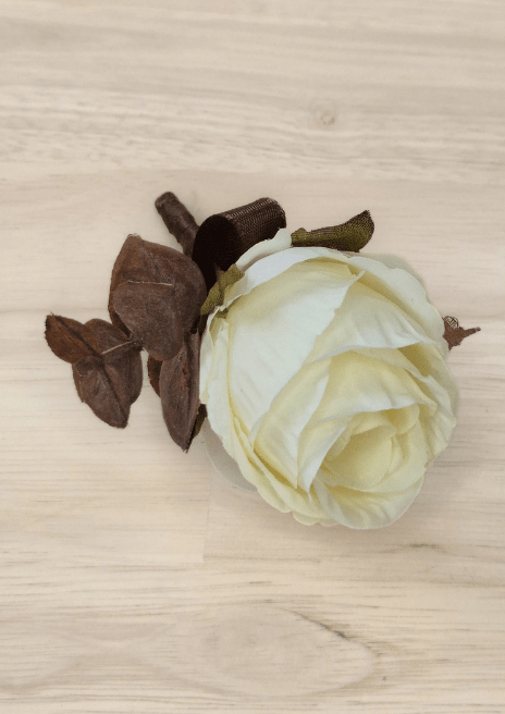 Artificial wedding boutonniere, overhead view of ivory faux rose petals, brown eucalyptus and ribbon bow. For formals, proms and ball occasions. Made in Melbourne by Flowers For Ever After, shipping Australia and Worldwide.