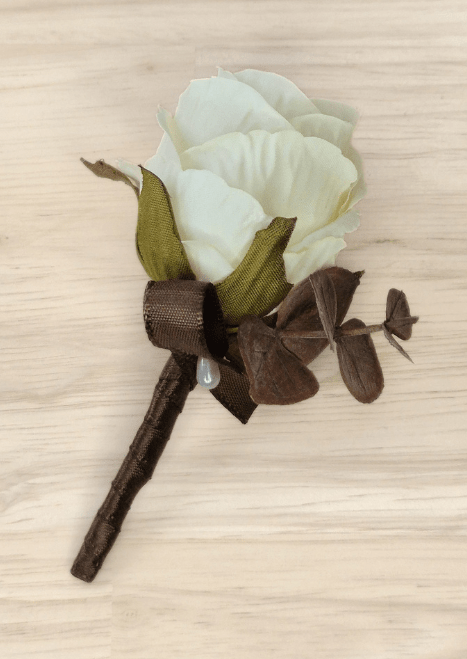 Artificial wedding boutonniere with ivory faux rose, brown eucalyptus, brown ribbon bow and brown-wrapped stem. For formals, proms and ball occasions. Made in Melbourne by Flowers For Ever After, shipping Australia and Worldwide.
