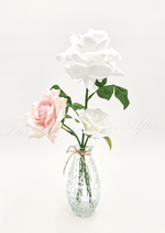 Artificial wedding table arrangement with small faux flowers and green sprigs in a glass jar. Made in Melbourne by Flowers For Ever After, shipping Australia and Worldwide.