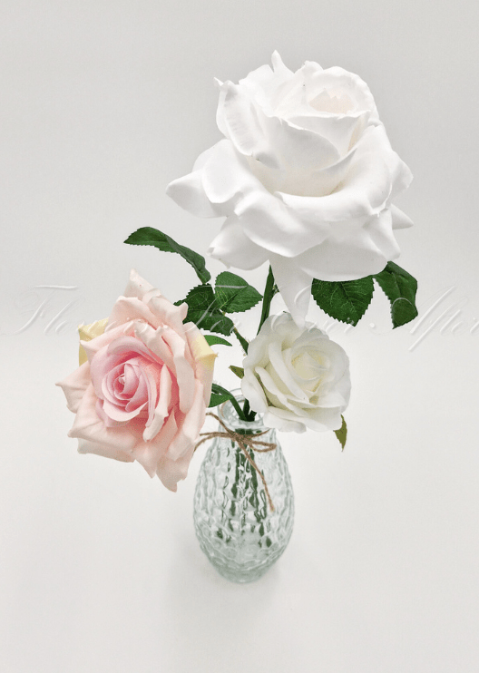 Artificial wedding table arrangement, overhead view of small faux flowers and green foliage in a glass jar. Made in Melbourne by Flowers For Ever After, shipping Australia and Worldwide.
