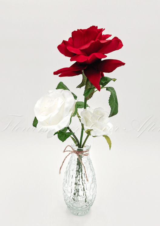 Artificial wedding table arrangement with small faux flowers and green sprigs in a glass jar. Made in Melbourne by Flowers For Ever After, shipping Australia and Worldwide.