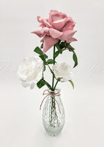 Artificial wedding table arrangement with faux roses and green foliage in a glass bottle. Made in Melbourne by Flowers For Ever After, shipping Australia and Worldwide.
