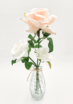 Artificial wedding table arrangement with small faux flowers and green leaves in a clear jar. Made in Melbourne by Flowers For Ever After, shipping Australia and Worldwide.
