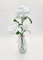 Artificial wedding table flower display with faux roses, smaller flowers and green leaves arranged in glass containers. Made in Melbourne by Flowers For Ever After, shipping Australia and Worldwide.