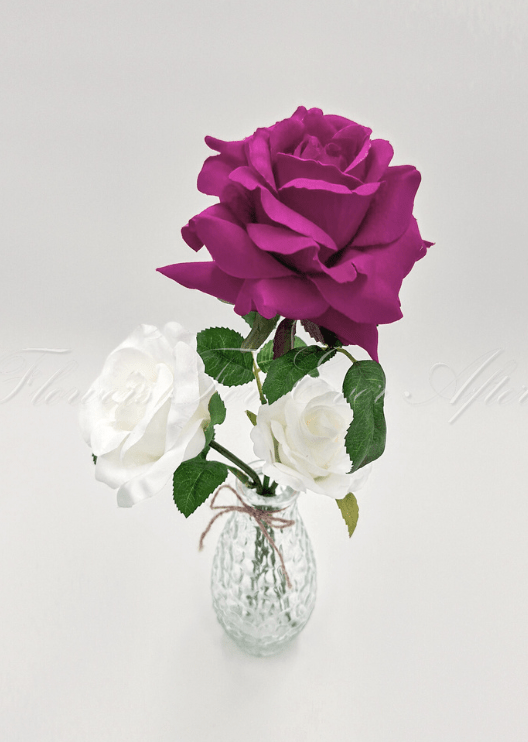 Artificial wedding table arrangement, overhead view of small faux blooms and green foliage in a glass jar. Made in Melbourne by Flowers For Ever After, shipping Australia and Worldwide.