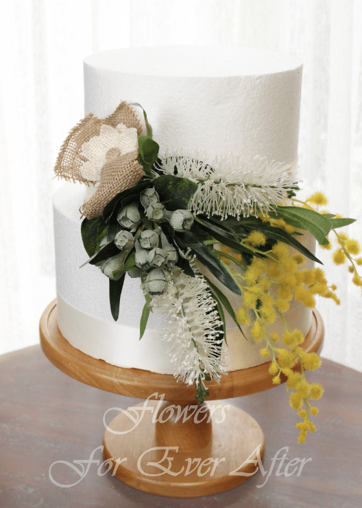 Artificial wedding cake flower set with red faux bottlebrush, yellow wattle and grey-green leaves in separate arrangements. For birthday, event and celebration cakes. Made in Melbourne by Flowers For Ever After, shipping Australia and Worldwide.