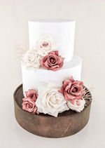 Artificial wedding cake decoration with dusty pink and white faux roses and fine pale sprigs across two tiers. For birthday, event and celebration cakes. Made in Melbourne by Flowers For Ever After, shipping Australia and Worldwide.
