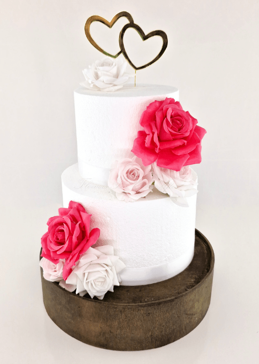 Artificial wedding cake floral decoration with mixed faux blooms and green foliage. For birthday, event and celebration cakes. Made in Melbourne by Flowers For Ever After, shipping Australia and Worldwide.