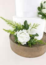 Artificial wedding cake flower close-up with a white faux rose, white orchid petals and fern-like greenery. For birthday, event and celebration cakes. Made in Melbourne by Flowers For Ever After, shipping Australia and Worldwide.