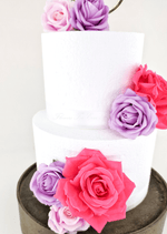 Artificial wedding cake decoration close-up showing faux rose petals and smaller blooms. For birthday, event and celebration cakes. Made in Melbourne by Flowers For Ever After, shipping Australia and Worldwide.