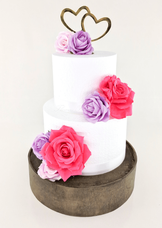 Artificial wedding cake decoration with mixed faux roses arranged across two tiers. For birthday, event and celebration cakes. Made in Melbourne by Flowers For Ever After, shipping Australia and Worldwide.