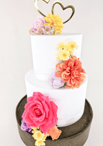 Artificial wedding cake flower close-up showing faux rose petals and green leaves. For birthday, event and celebration cakes. Made in Melbourne by Flowers For Ever After, shipping Australia and Worldwide.