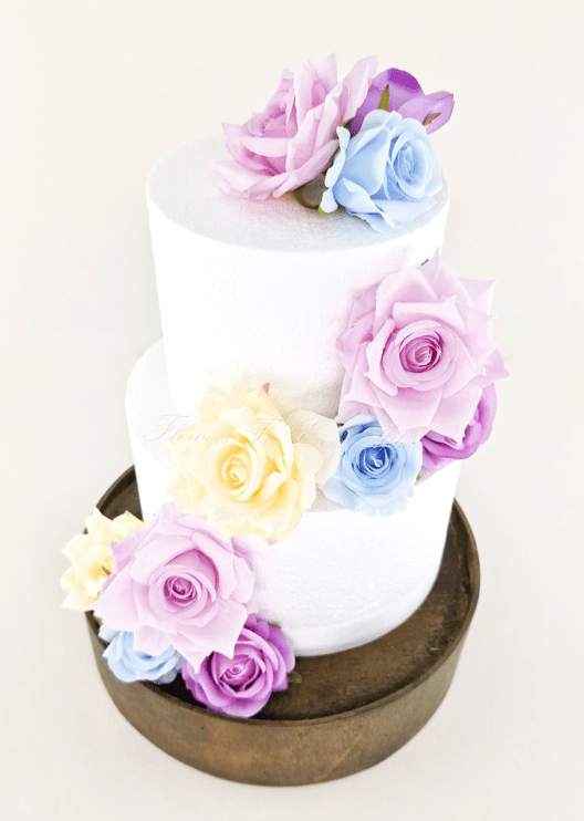 Artificial wedding cake decoration close-up showing layered faux rose petals. For birthday, event and celebration cakes. Made in Melbourne by Flowers For Ever After, shipping Australia and Worldwide.