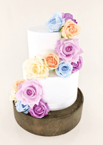 Artificial wedding cake floral decoration, front view of faux roses arranged across two tiers. For birthday, event and celebration cakes. Made in Melbourne by Flowers For Ever After, shipping Australia and Worldwide.