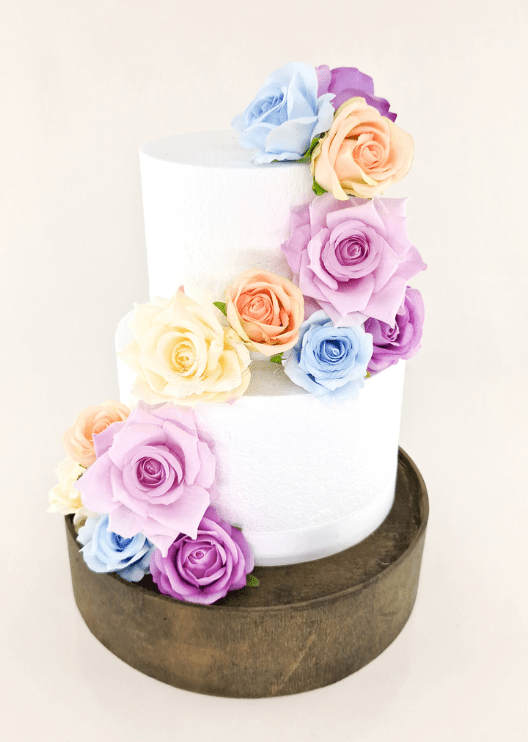 Artificial wedding cake floral decoration, front view of faux roses arranged across two tiers. For birthday, event and celebration cakes. Made in Melbourne by Flowers For Ever After, shipping Australia and Worldwide.