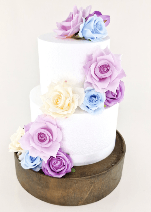 Artificial wedding cake decoration with faux roses arranged in clusters over two tiers. For birthday, event and celebration cakes. Made in Melbourne by Flowers For Ever After, shipping Australia and Worldwide.