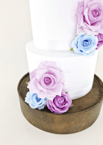 Artificial wedding cake decoration close-up showing faux rose petals and smaller blooms. For birthday, event and celebration cakes. Made in Melbourne by Flowers For Ever After, shipping Australia and Worldwide.