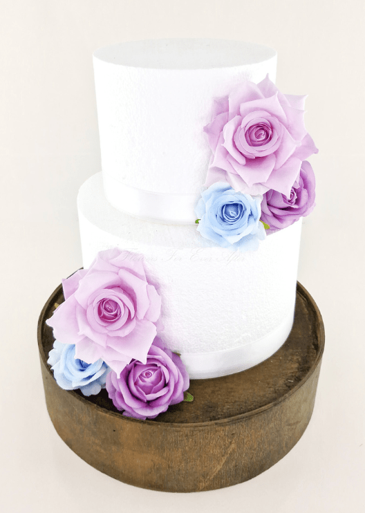 Artificial wedding cake decoration with faux rose clusters placed at the upper and lower tiers. For birthday, event and celebration cakes. Made in Melbourne by Flowers For Ever After, shipping Australia and Worldwide.