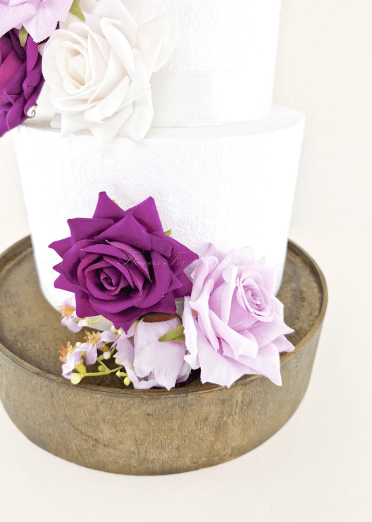 Artificial wedding cake floral decoration, angled view of faux roses and smaller blooms. For birthday, event and celebration cakes. Made in Melbourne by Flowers For Ever After, shipping Australia and Worldwide.