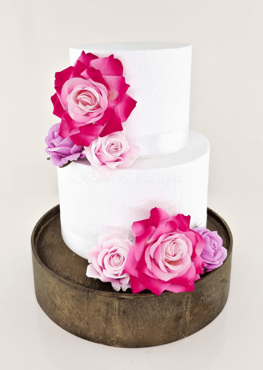 Artificial wedding cake decoration with mixed faux roses arranged across two tiers. For birthday, event and celebration cakes. Made in Melbourne by Flowers For Ever After, shipping Australia and Worldwide.