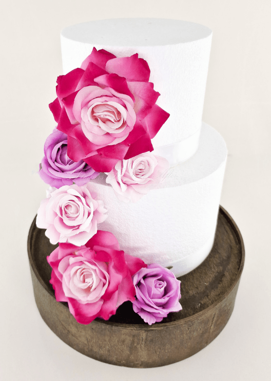 Artificial wedding cake floral decoration close-up showing layered faux flower petals. For birthday, event and celebration cakes. Made in Melbourne by Flowers For Ever After, shipping Australia and Worldwide.