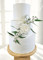 Artificial wedding cake decoration with white and dusty pink faux roses, berry sprigs and fine green foliage arranged over two tiers. For birthday, event and celebration cakes. Made in Melbourne by Flowers For Ever After, shipping Australia and Worldwide.