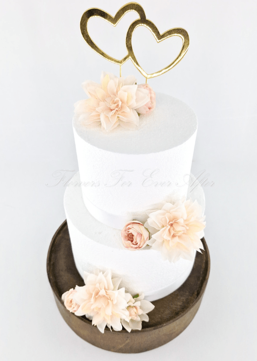Artificial wedding cake flower pieces showing layered faux rose petals and green sepals. For birthday, event and celebration cakes. Made in Melbourne by Flowers For Ever After, shipping Australia and Worldwide.