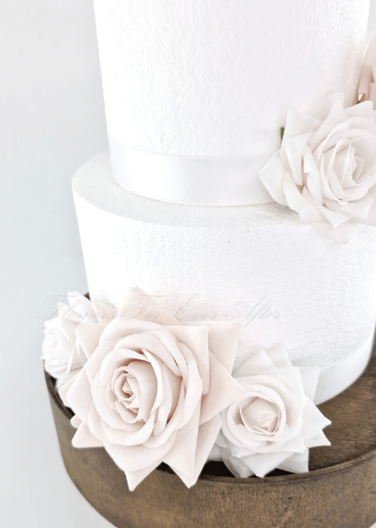 Artificial wedding cake flower pieces showing faux rose petals, green sepals and mounting wires. For birthday, event and celebration cakes. Made in Melbourne by Flowers For Ever After, shipping Australia and Worldwide.