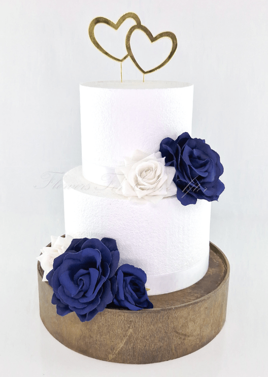 Artificial wedding cake decoration with loose faux rose heads and green sepals. For birthday, event and celebration cakes. Made in Melbourne by Flowers For Ever After, shipping Australia and Worldwide.