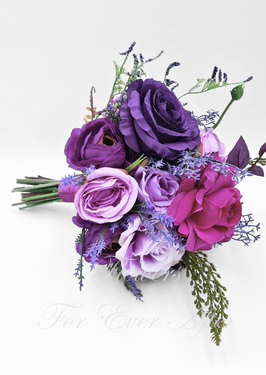 Artificial wedding bridesmaid bouquet with white faux roses, pale blooms and greenery, with a ribbon-wrapped handle. Made in Melbourne by Flowers For Ever After, shipping Australia and Worldwide.