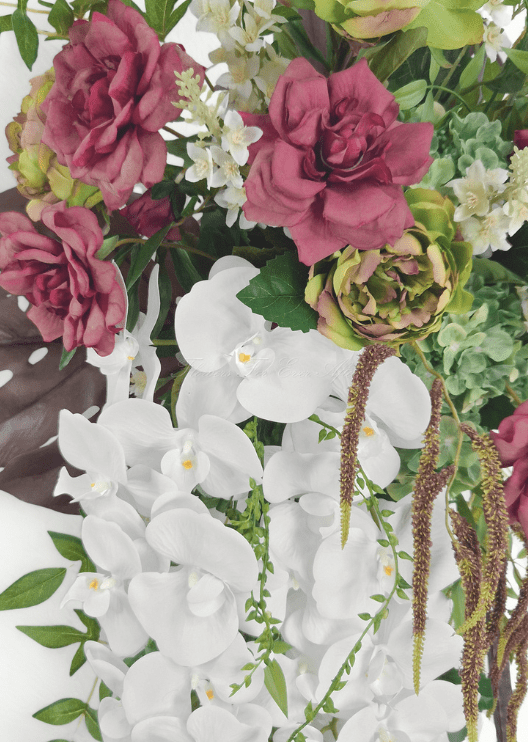 Artificial wedding arbor floral close-up with mauve and green faux roses, pale green hydrangea, white orchids and long bronze strands. Made in Melbourne by Flowers For Ever After, shipping Australia and Worldwide.