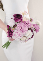 Artificial wedding bridesmaid bouquet, angled view of lilac, burgundy and white faux flowers and green leaves. Made in Melbourne by Flowers For Ever After, shipping Australia and Worldwide.