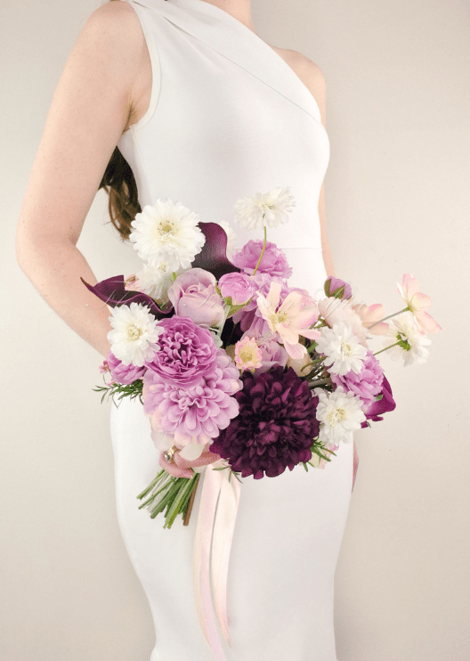 Artificial wedding bridal bouquet close-up with lilac, burgundy and white faux flowers and green foliage. Made in Melbourne by Flowers For Ever After, shipping Australia and Worldwide.