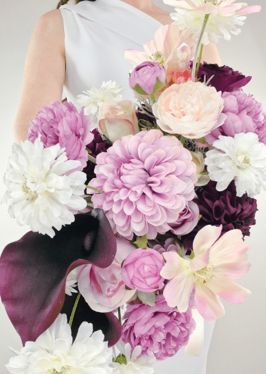 Artificial wedding bridal bouquet with lilac, burgundy and white faux blooms, green foliage and a wrapped handle. Made in Melbourne by Flowers For Ever After, shipping Australia and Worldwide.