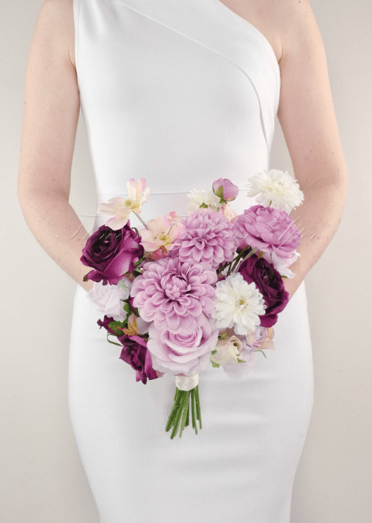 Artificial wedding bridesmaid bouquet with lilac, burgundy and white faux blooms and a wrapped handle. Made in Melbourne by Flowers For Ever After, shipping Australia and Worldwide.