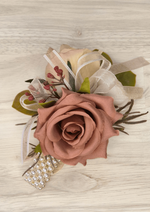 Artificial wedding wrist corsage with dusty rose and champagne faux roses, pink berry sprigs, ivory ribbon and pearl-style bracelet. For formals, proms and ball occasions. Made in Melbourne by Flowers For Ever After, shipping Australia and Worldwide.