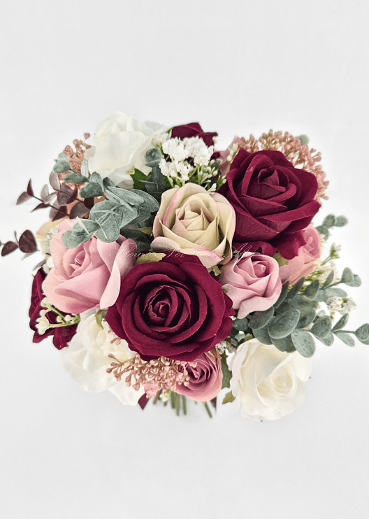 Artificial wedding bouquet close-up with burgundy, blush, beige and white faux roses, eucalyptus and bronze flower clusters. Made in Melbourne by Flowers For Ever After, shipping Australia and Worldwide.